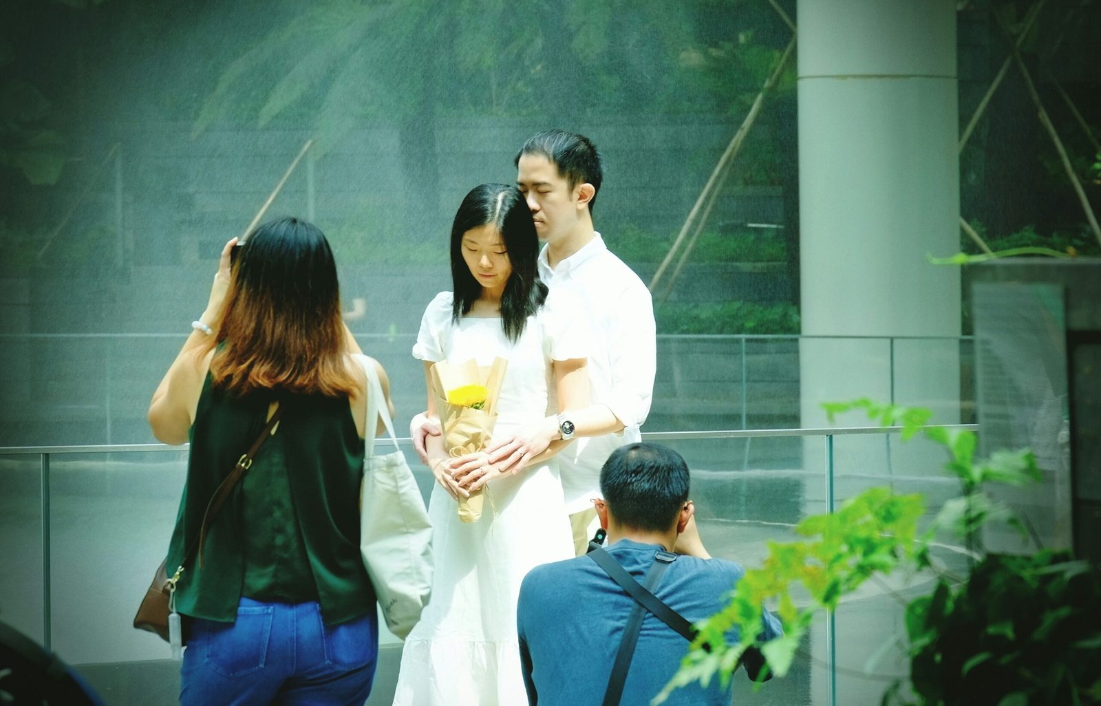 man in white dress shirt holding drinking glass