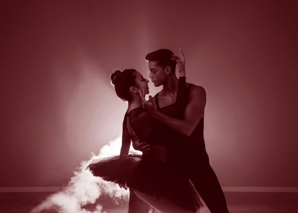 A man and a woman dance on a cloud of smoke